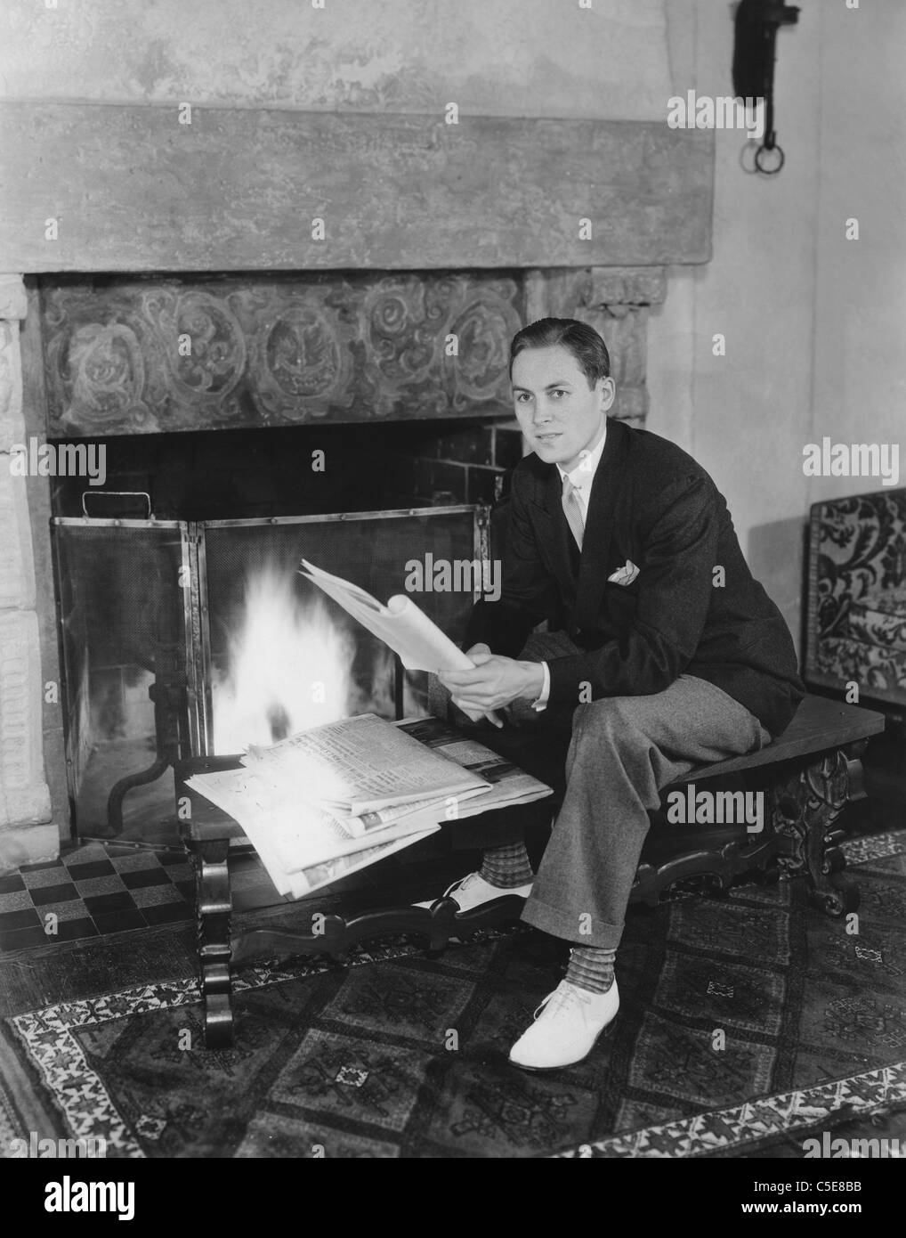 Fireside reading Stock Photo