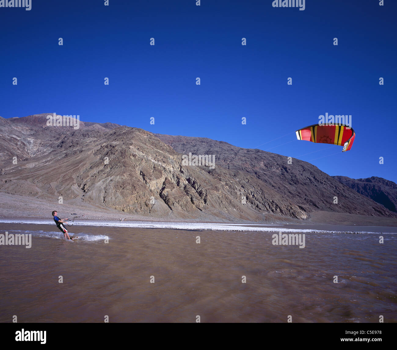 Kitesurfing in one of in one of the most unexpected places on earth. in 2005, Death Valley National Park saw a record rainfall. California, USA. Stock Photo