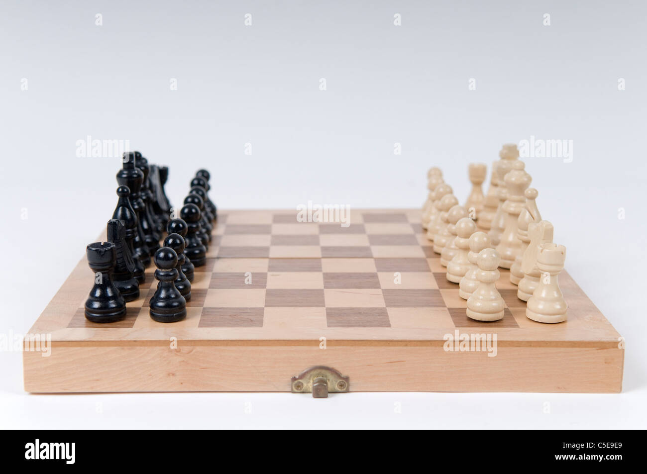 Close-up of a chess board against gray background Stock Photo