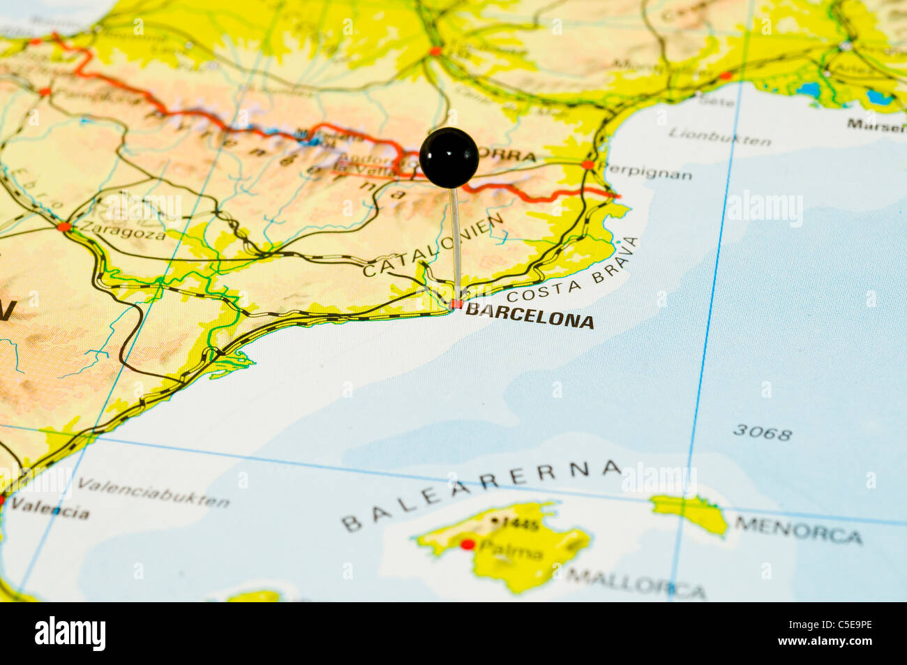 Close-up of a black map pin on a map Stock Photo