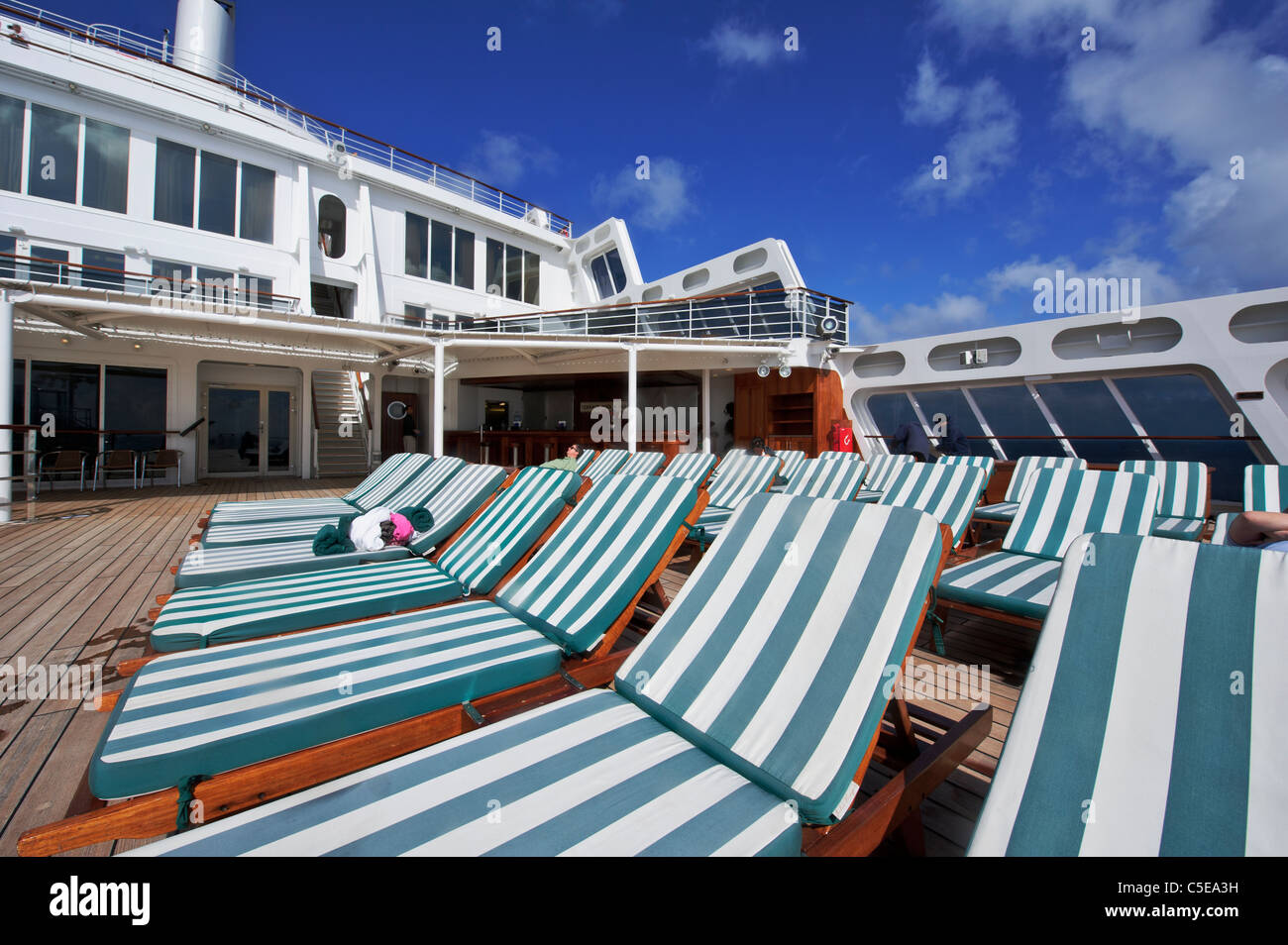 Rows of deck chairs for passengers on upper deck, Cunard Queen Mary 2