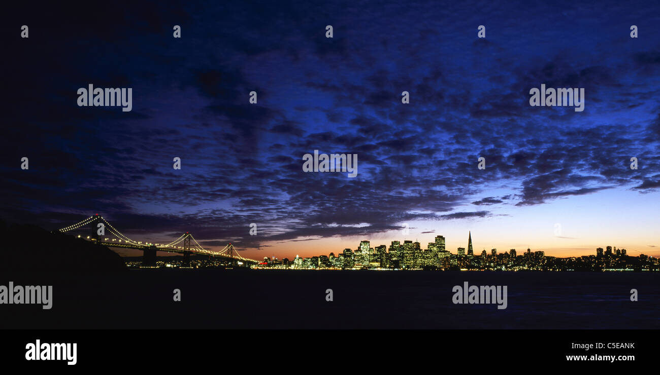 San Francisco skyline and the Bay Bridge viewed at twilight from Treasure Island. California, USA. Stock Photo