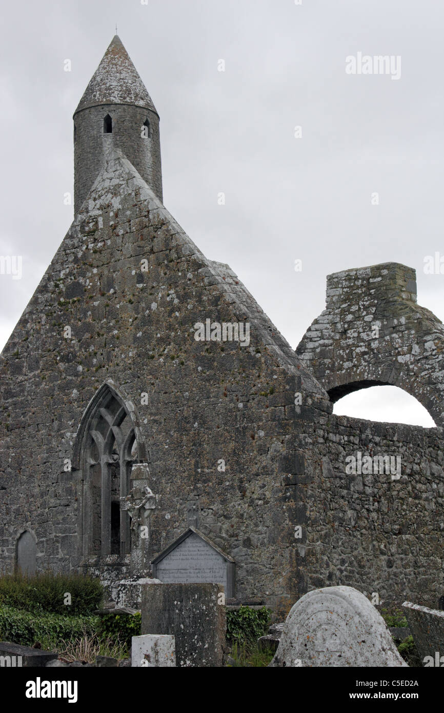 Kilmacduagh Monastery, County Galway, Ireland. At 34 metres (112 feet), the round tower is the tallest in Ireland. Stock Photo