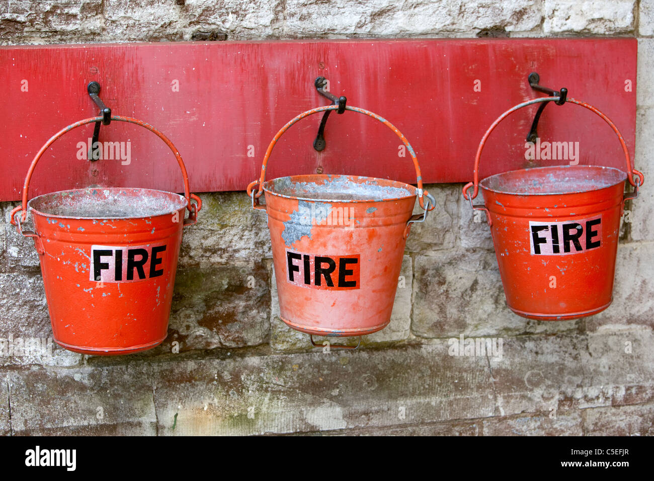 Old fashioned fire buckets on the platform at Corfe castle Railway