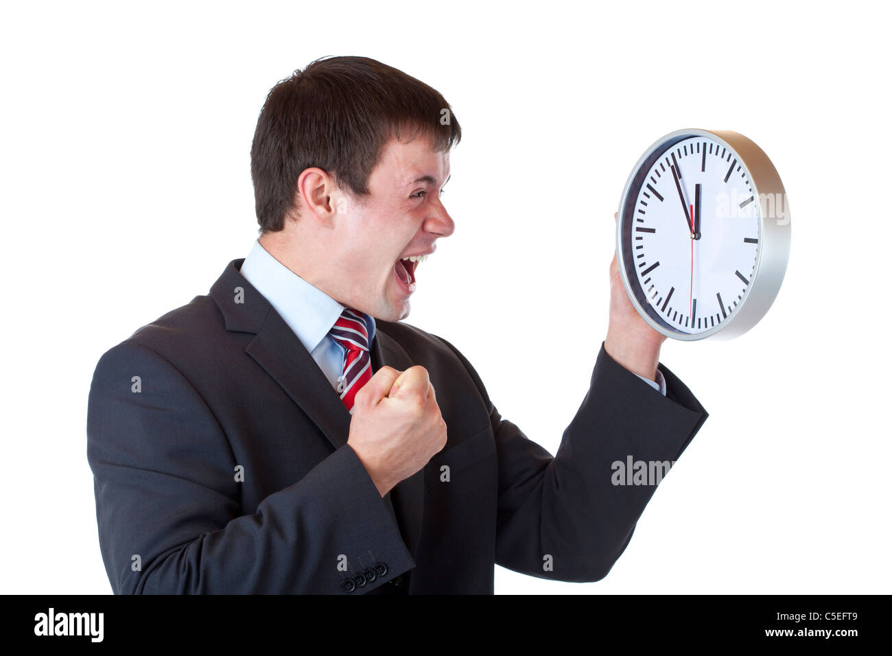 Stressed manager under time pressure clenches his fist and shouts.Isolated on white background Stock Photo