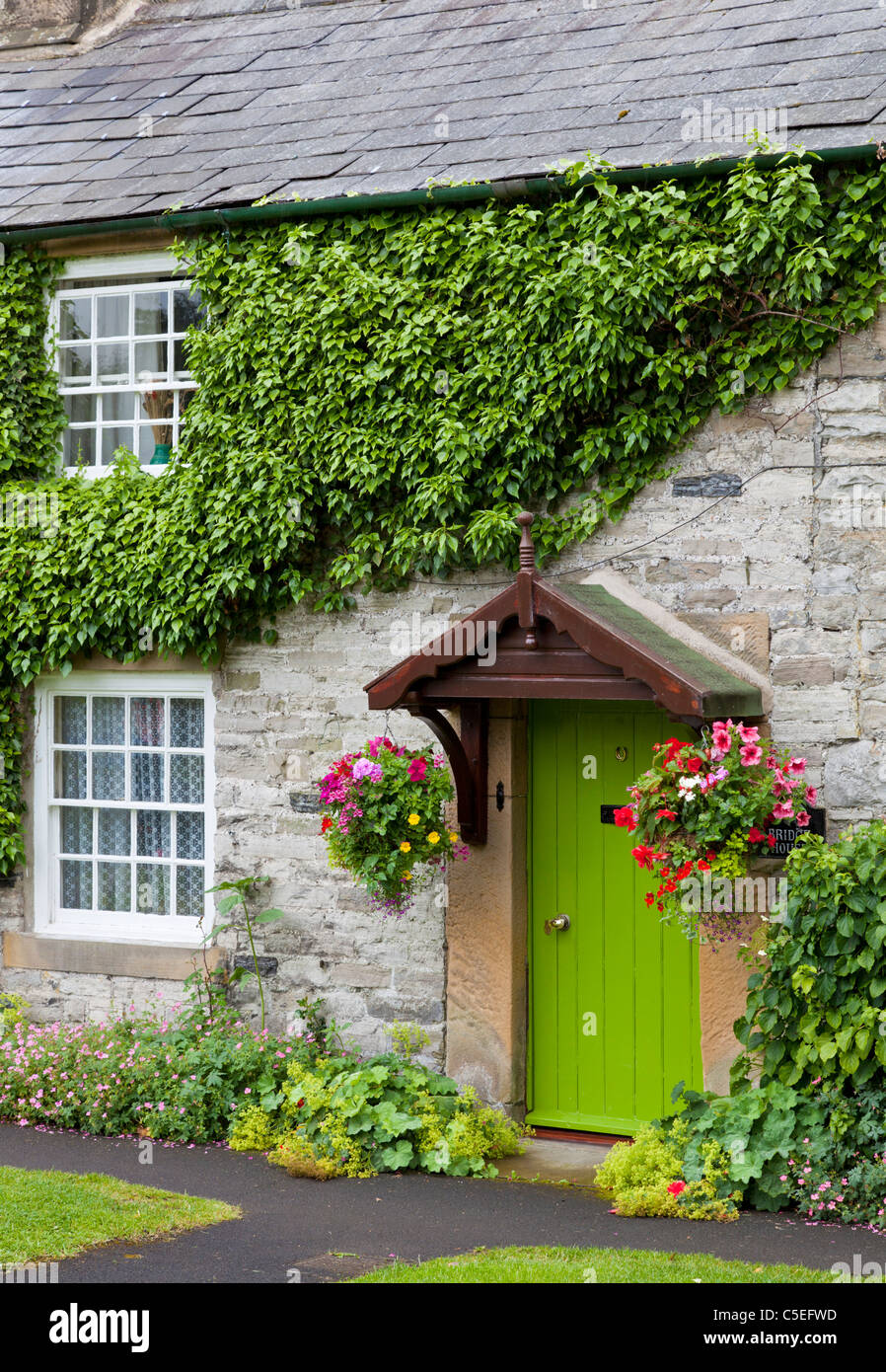 Traditional stone cottage at Ashford in the water Peak District national park Derbyshire England