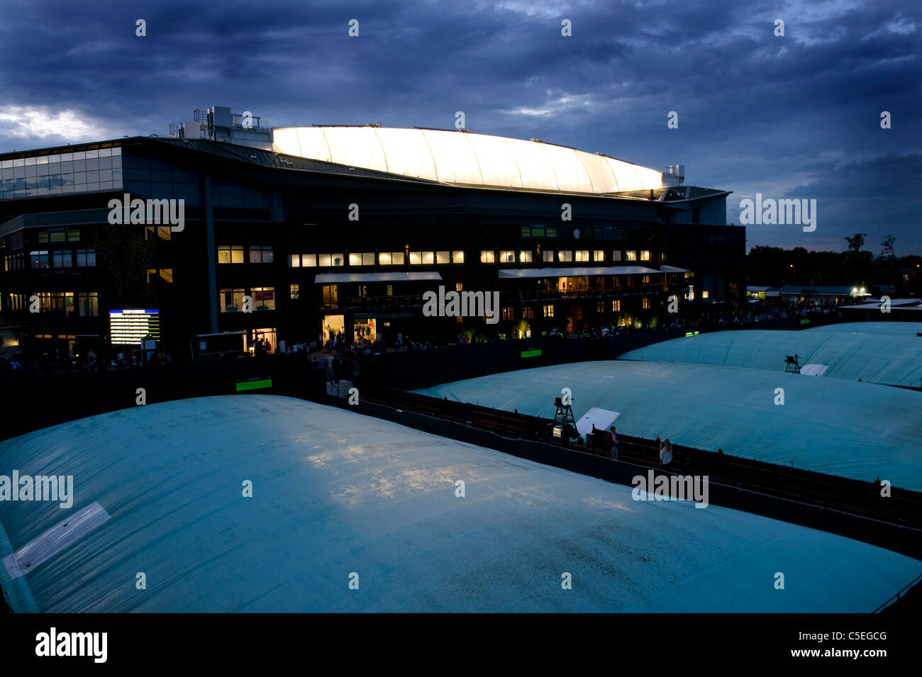 Centre Court lit up at dusk during the 2011 Wimbledon Tennis Championships  Stock Photo