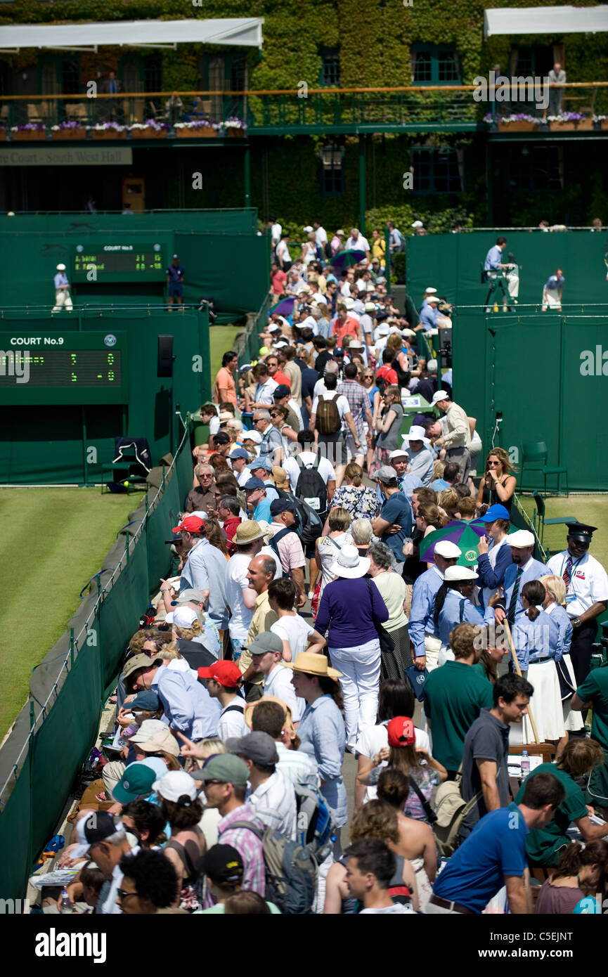 Crowds line the southern outside courts during the 2011 Wimbledon Tennis Championships Stock Photo