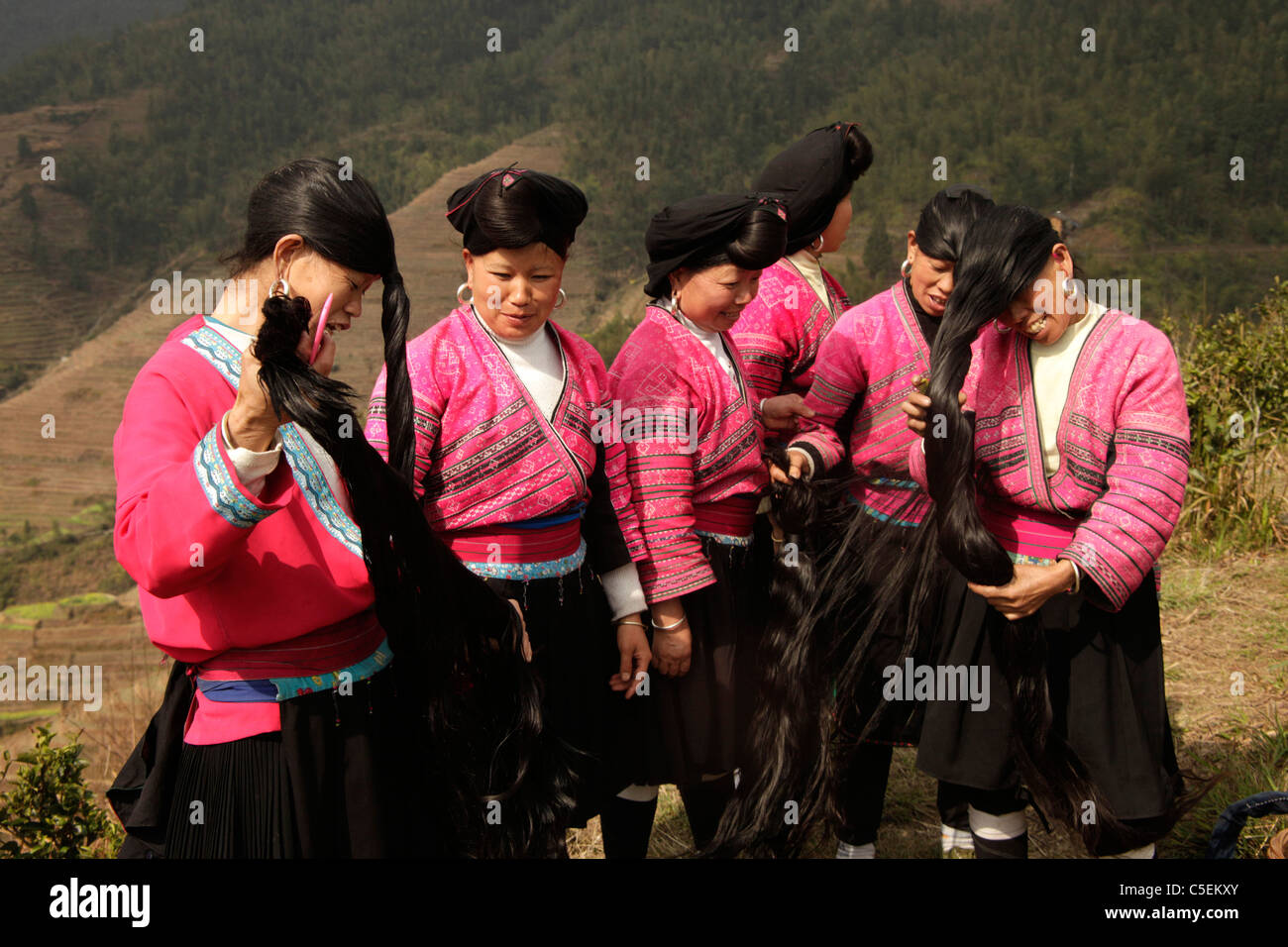 Women of the Yao minority with traditional costumes and their characteristic hairstyle at Ping An near Longsheng, Guangxi, China Stock Photo