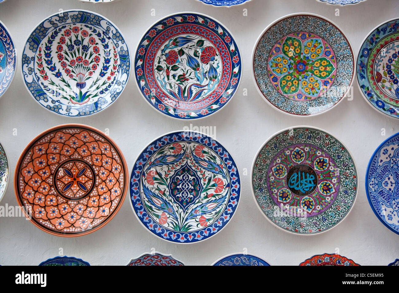 Colourful bowls hanging from a wall Stock Photo Alamy