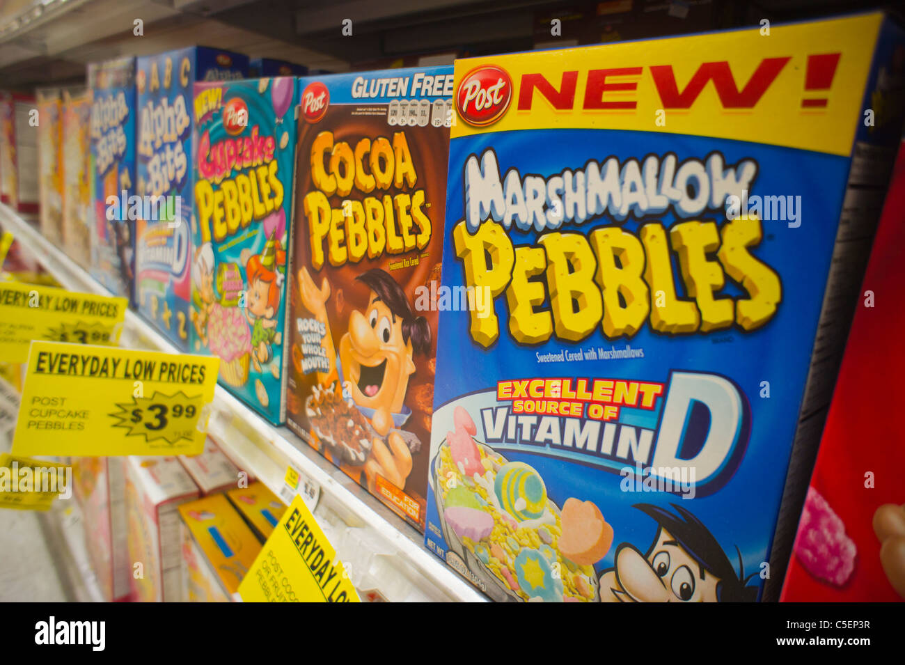 Boxes of Post breakfast cereal featuring cartoon characters on supermarket shelves in New York Stock Photo