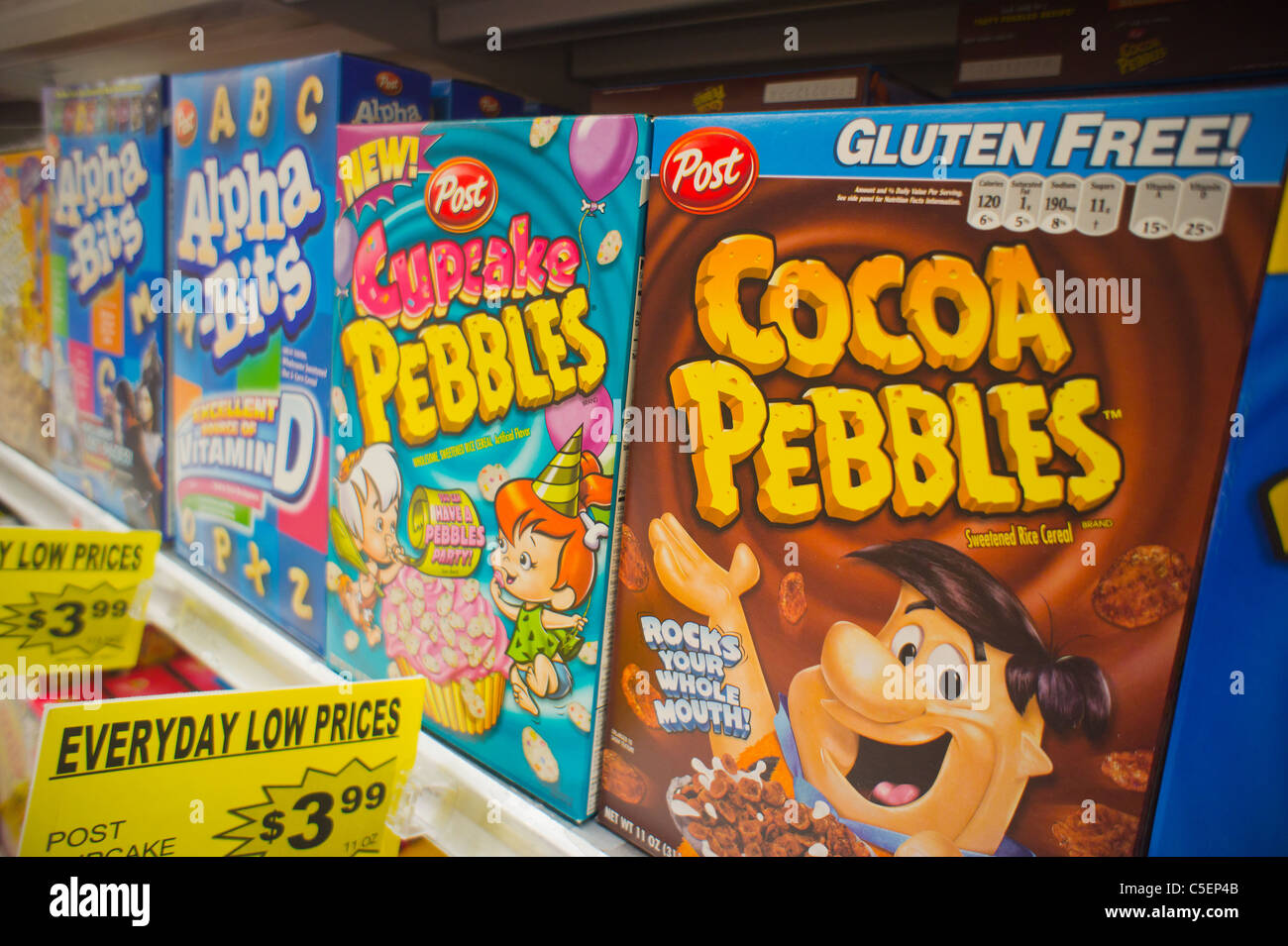 Boxes of Post breakfast cereal featuring cartoon characters on supermarket shelves in New York Stock Photo