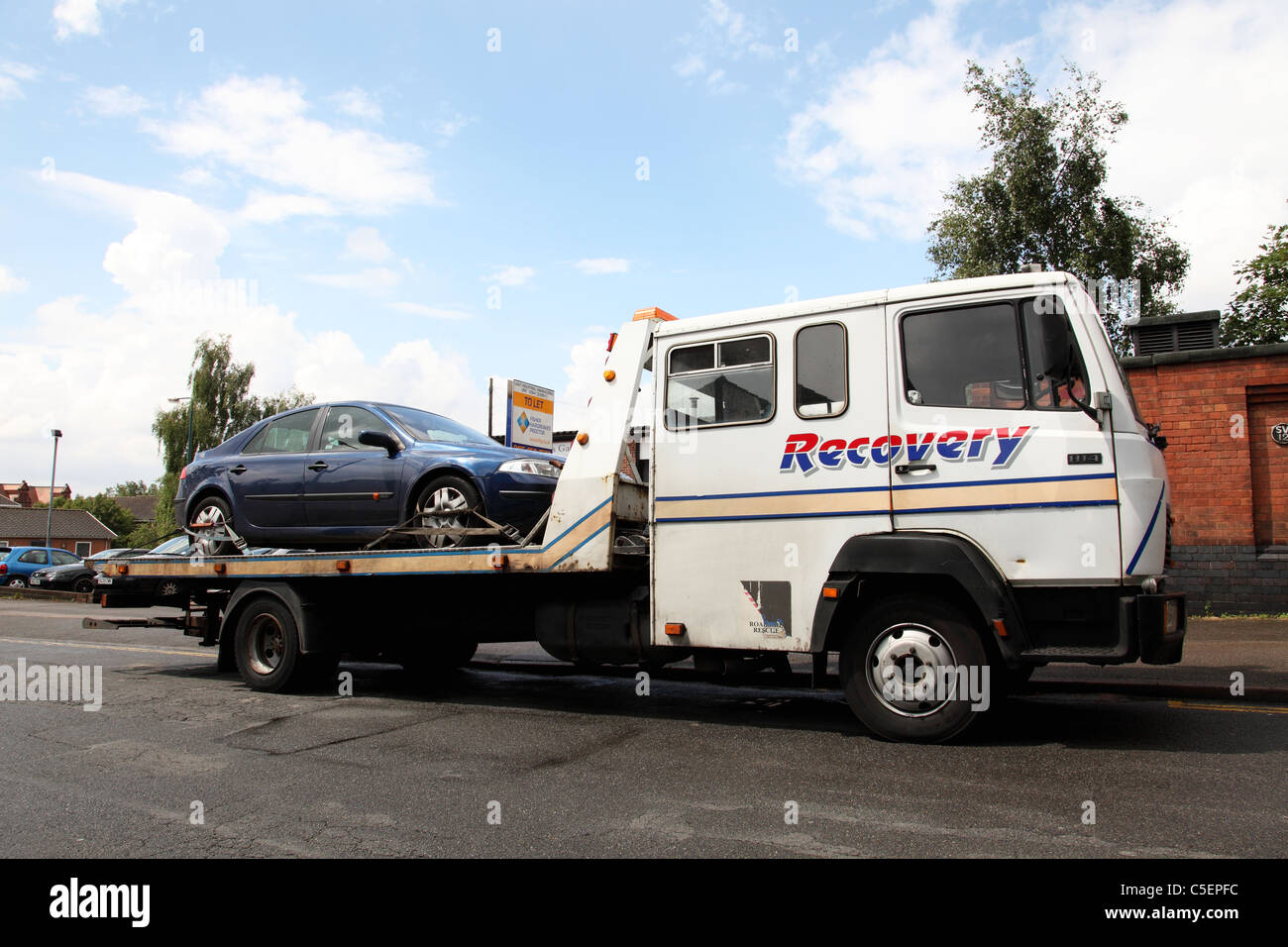 A car on a recovery vehicle in the U.K. Stock Photo