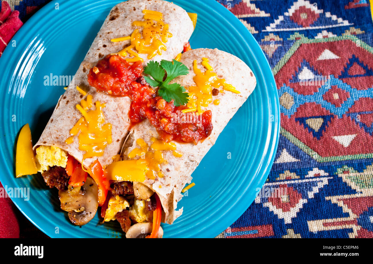These classic egg burritos have a ton of fresh mushrooms and sweet peppers plus pork chorizo. Stock Photo