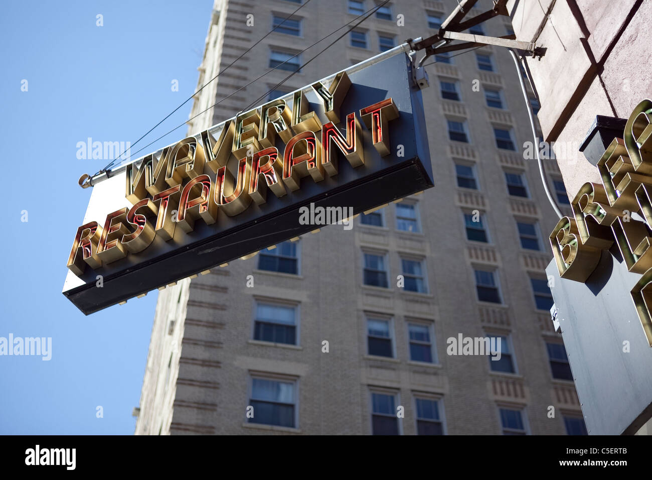 Waverly Restaurant sign, West Village, New York City with blue sky and building backdrop Stock