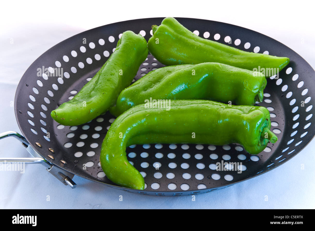 Green chili peppers are large, mild chilies are available in most local grocery stores. Stock Photo