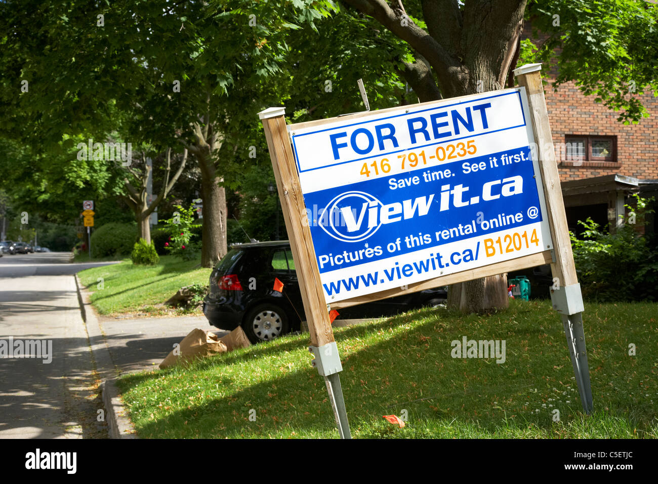 for rent sign on the lawn of upmarket house in casa loma spadina area of toronto ontario canada Stock Photo