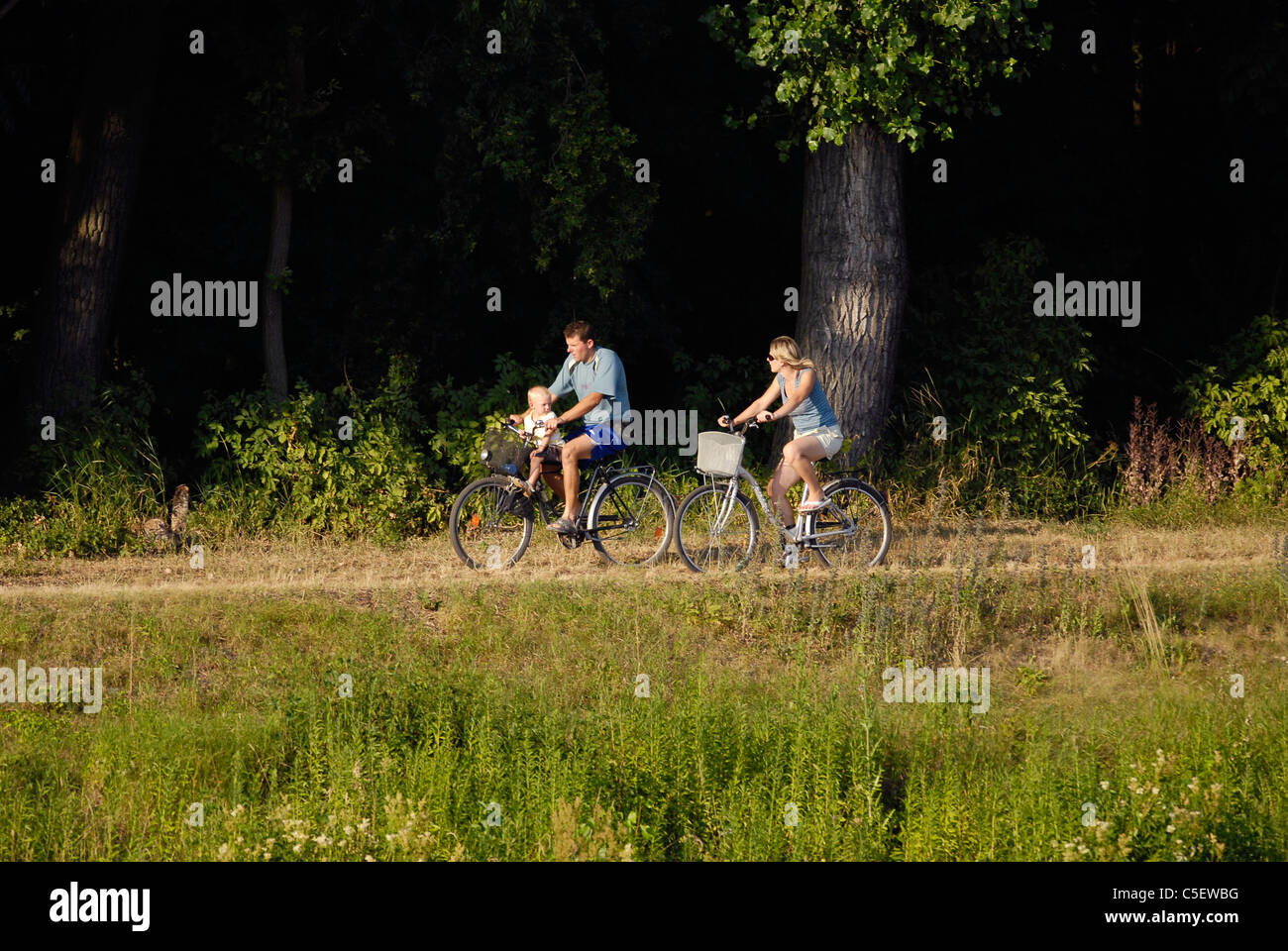 Family with child on the bikes Stock Photo