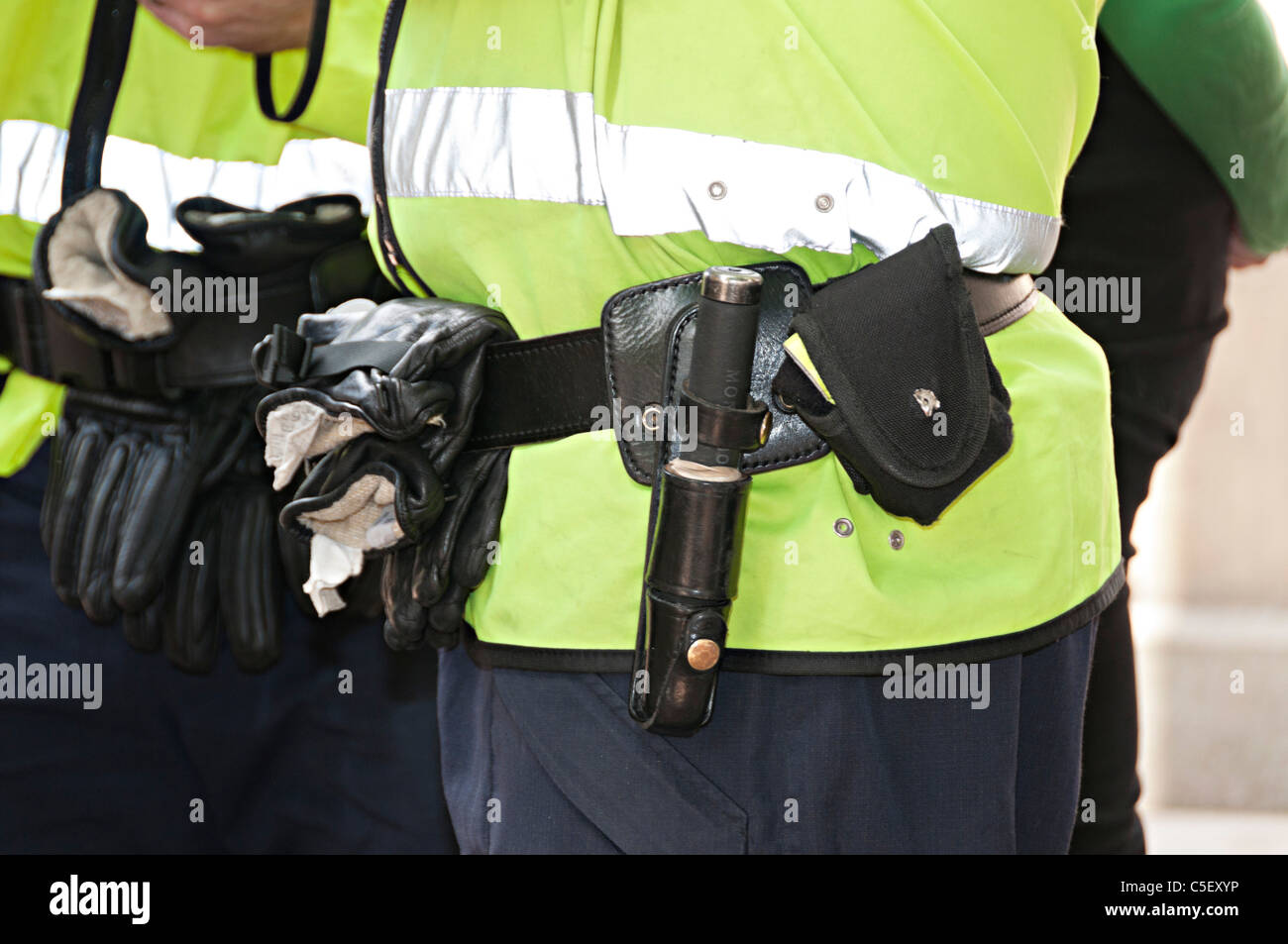 police belt with handcuffs truncheon and pepper spray in the uk Stock Photo
