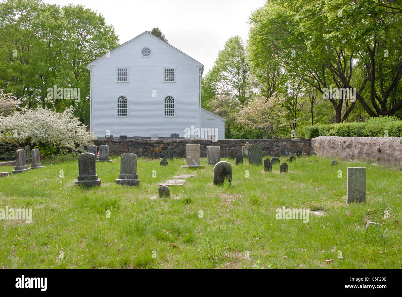 An old church in Wickford, Rhode Island is surrounded by graveyards. Stock Photo
