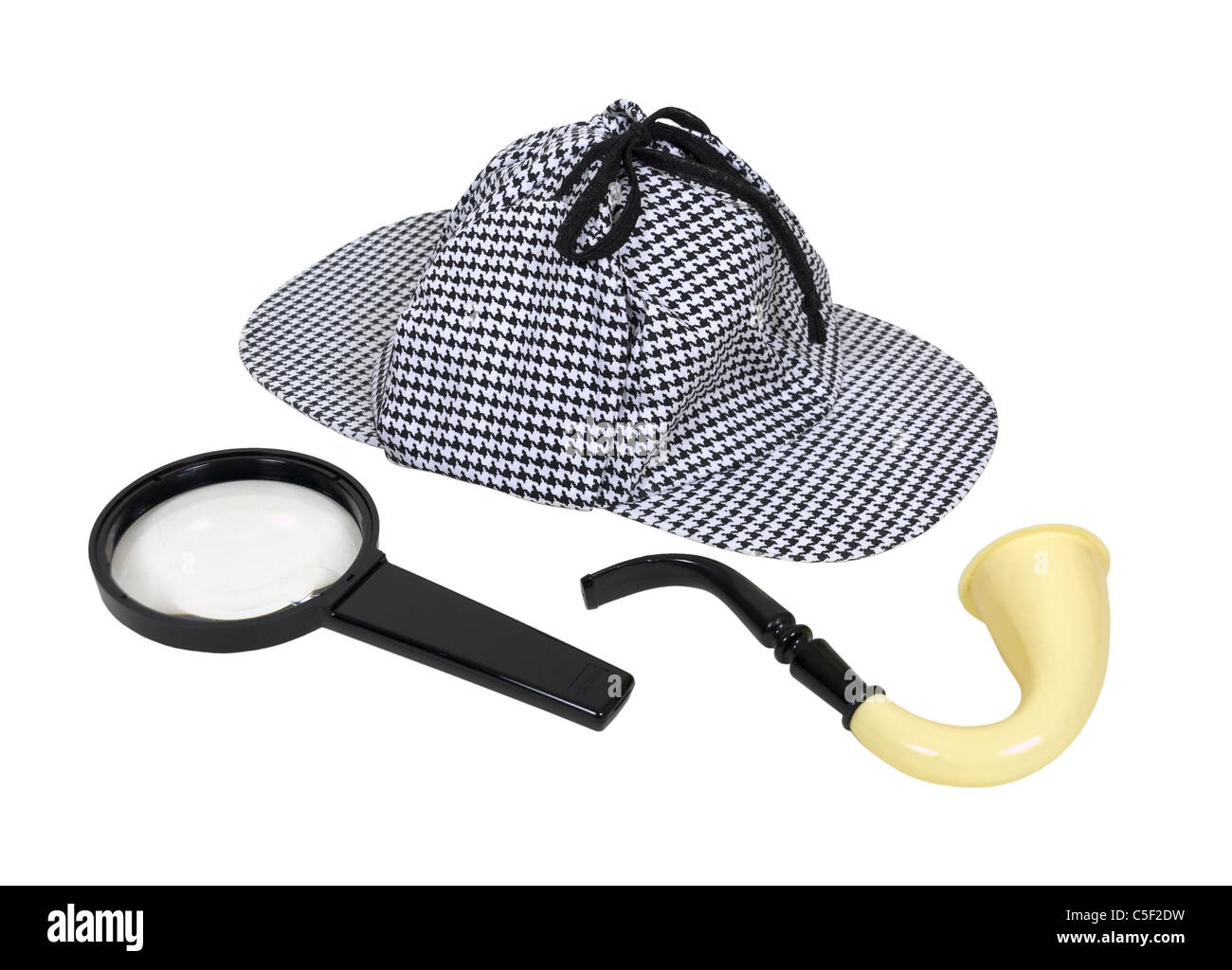 Retro detective tools including a meershaum pipe, magnifying glass and a deerstalker hat - path included Stock Photo