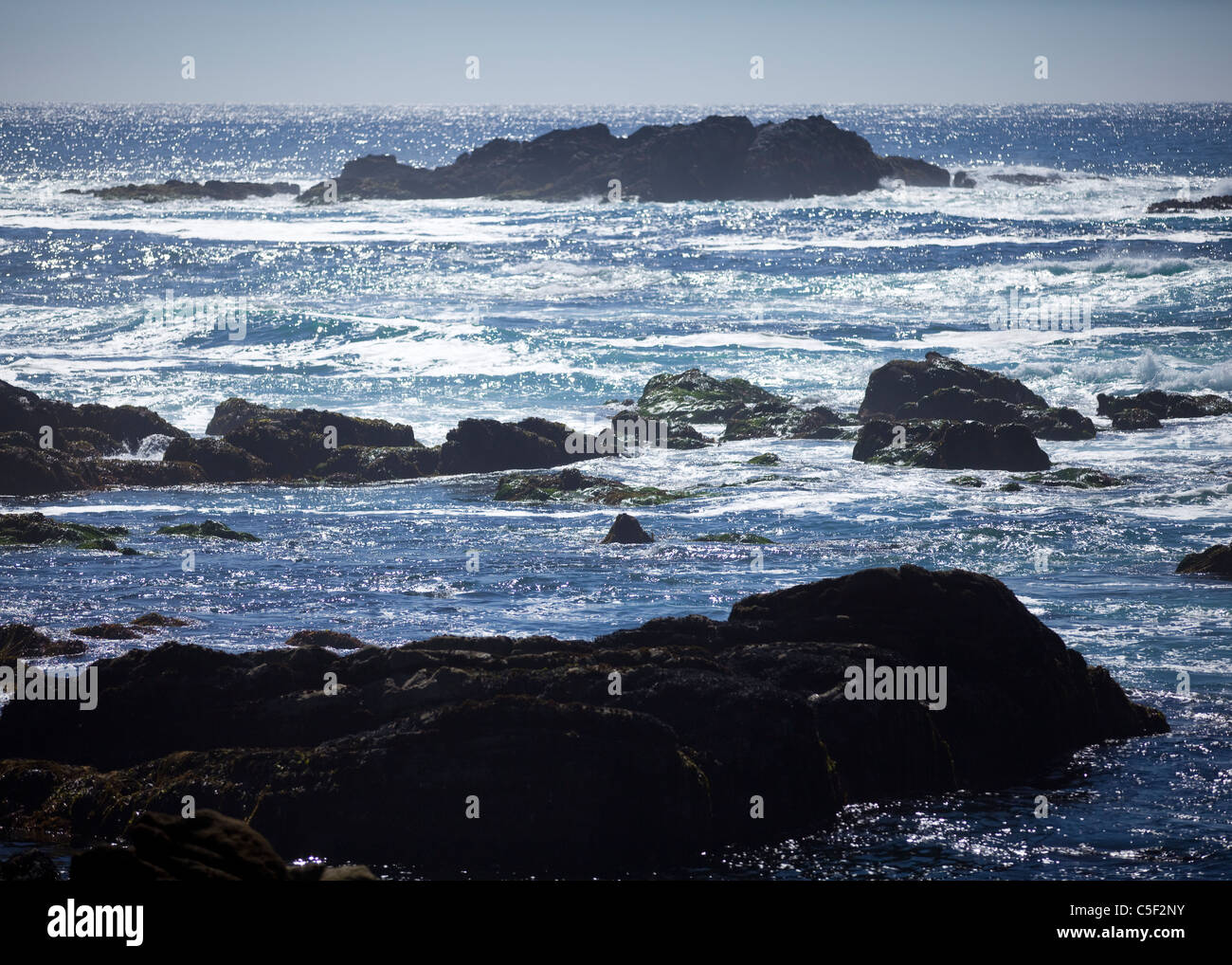 A rocky coast line creates rough water on the Pacific Stock Photo Alamy