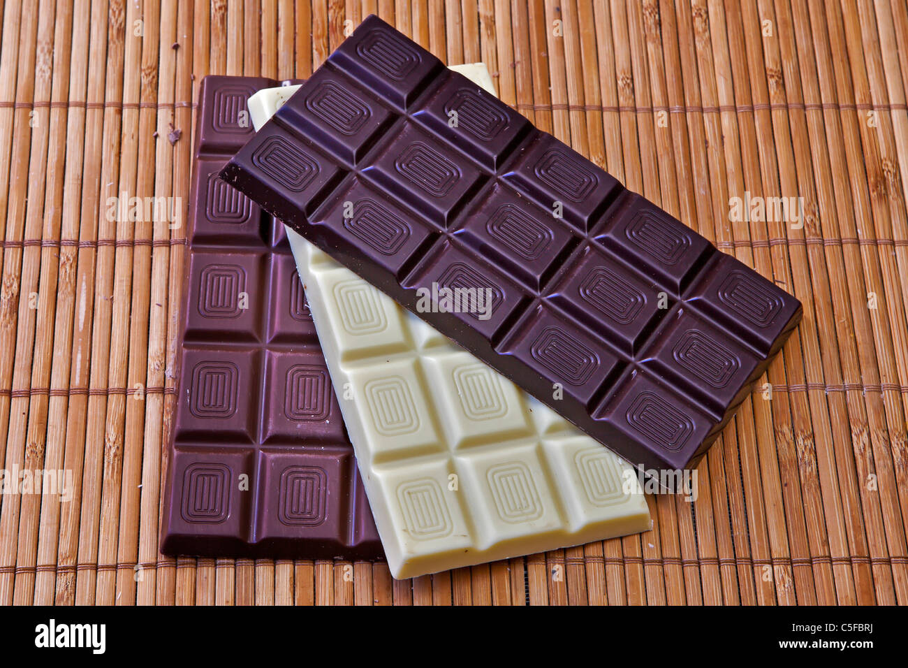 Bar of chocolate in milk, white chocolate and dark chocolate Stock Photo