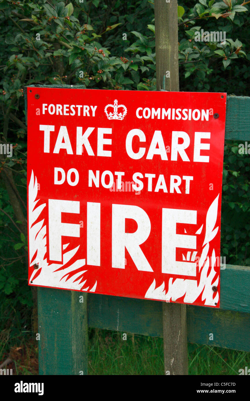 Fire warning sign in forest. UK. Stock Photo