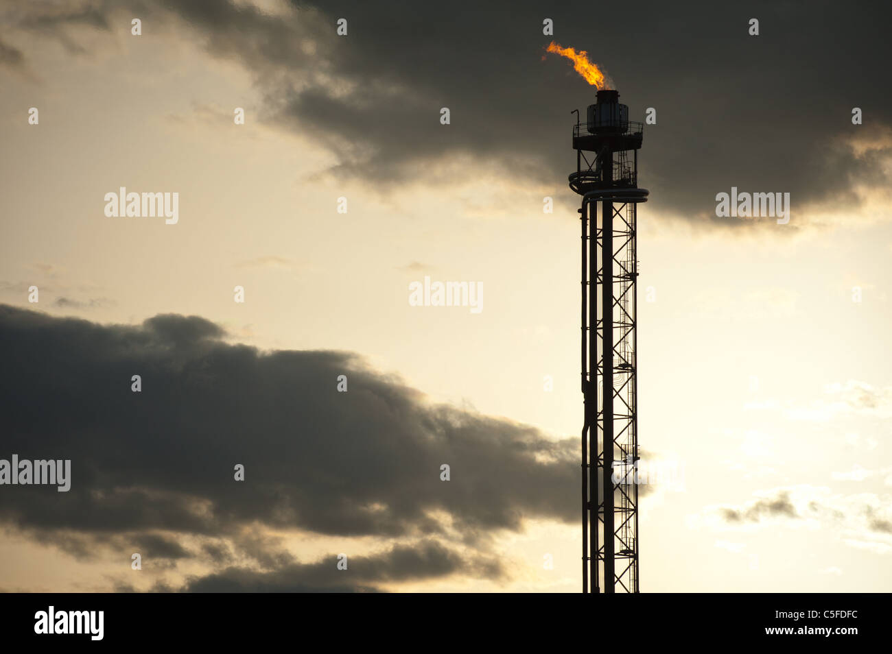 silhouette of oil refinery tower at sunset Stock Photo - Alamy