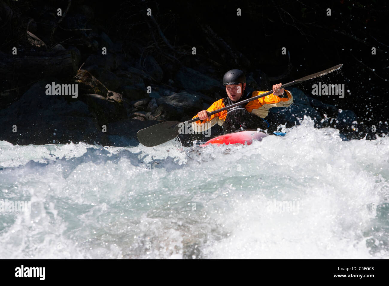 Whitewater kayaker riding rapids on Inn River near Pfunds, Austria Stock Photo