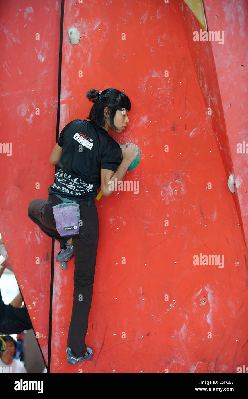 Young girl in a indoor climbing competition in Singapore Stock Photo