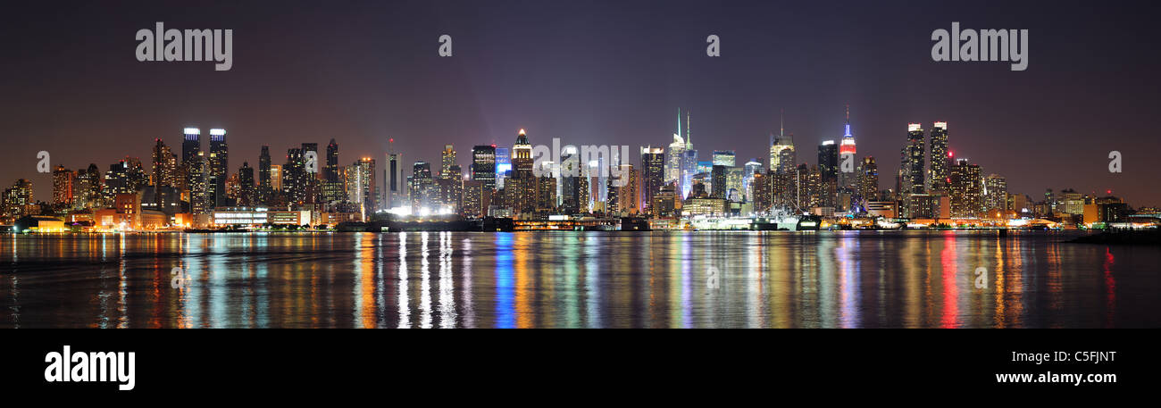 New York City Manhattan midtown skyline at night with lights reflection ...