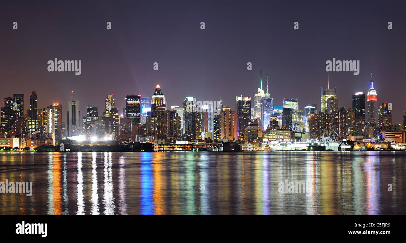 New York City Manhattan midtown skyline at night with lights reflection ...