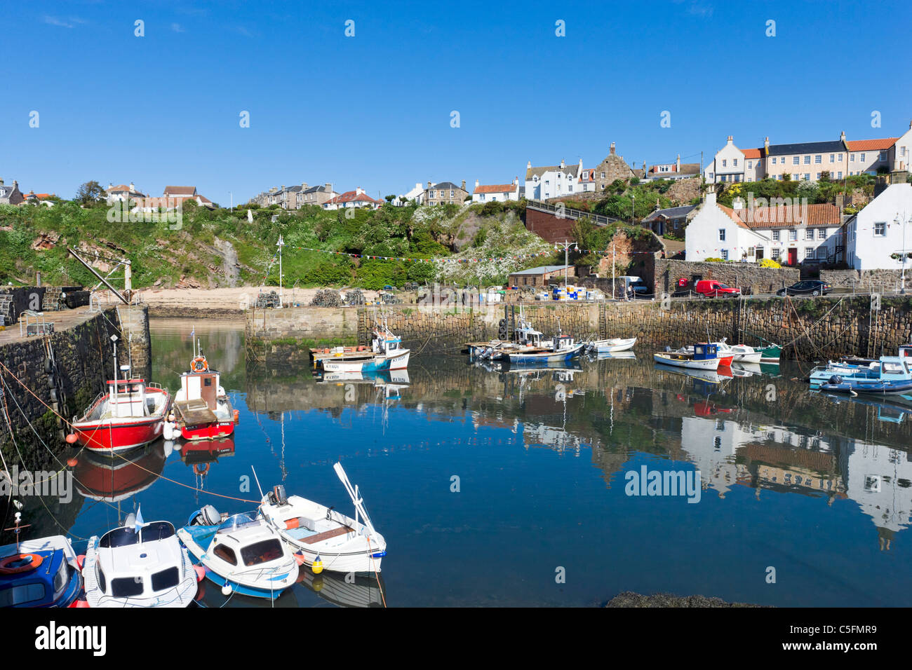 Local fishing boats in the harbour of the picturesque village of Crail, East Neuk, Fife, Scotland, UK Stock Photo
