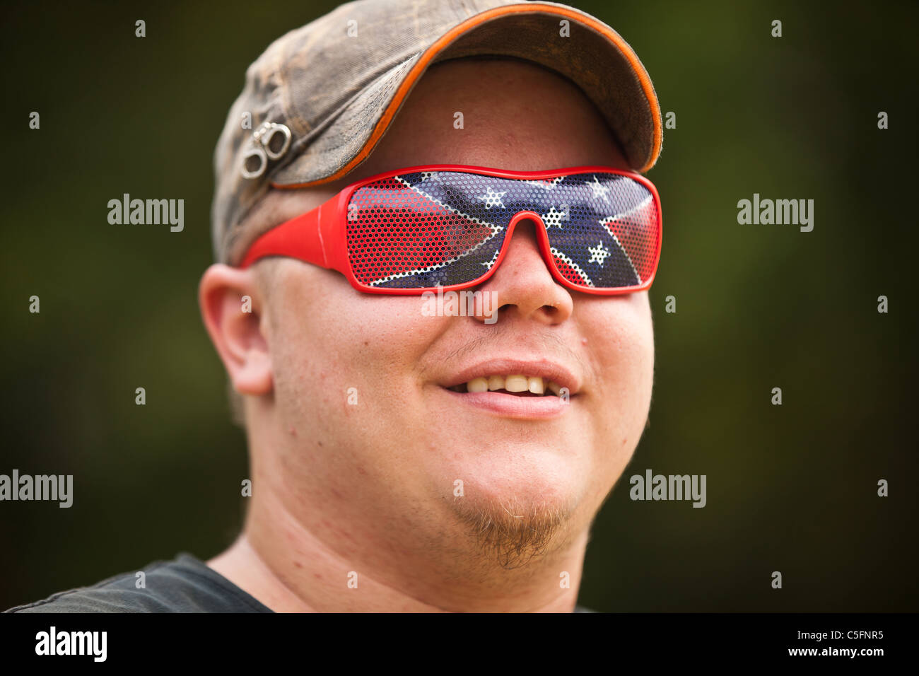 A participant wears confederate sunglasses during the annual Summer Redneck  Games Dublin, GA Stock Photo - Alamy