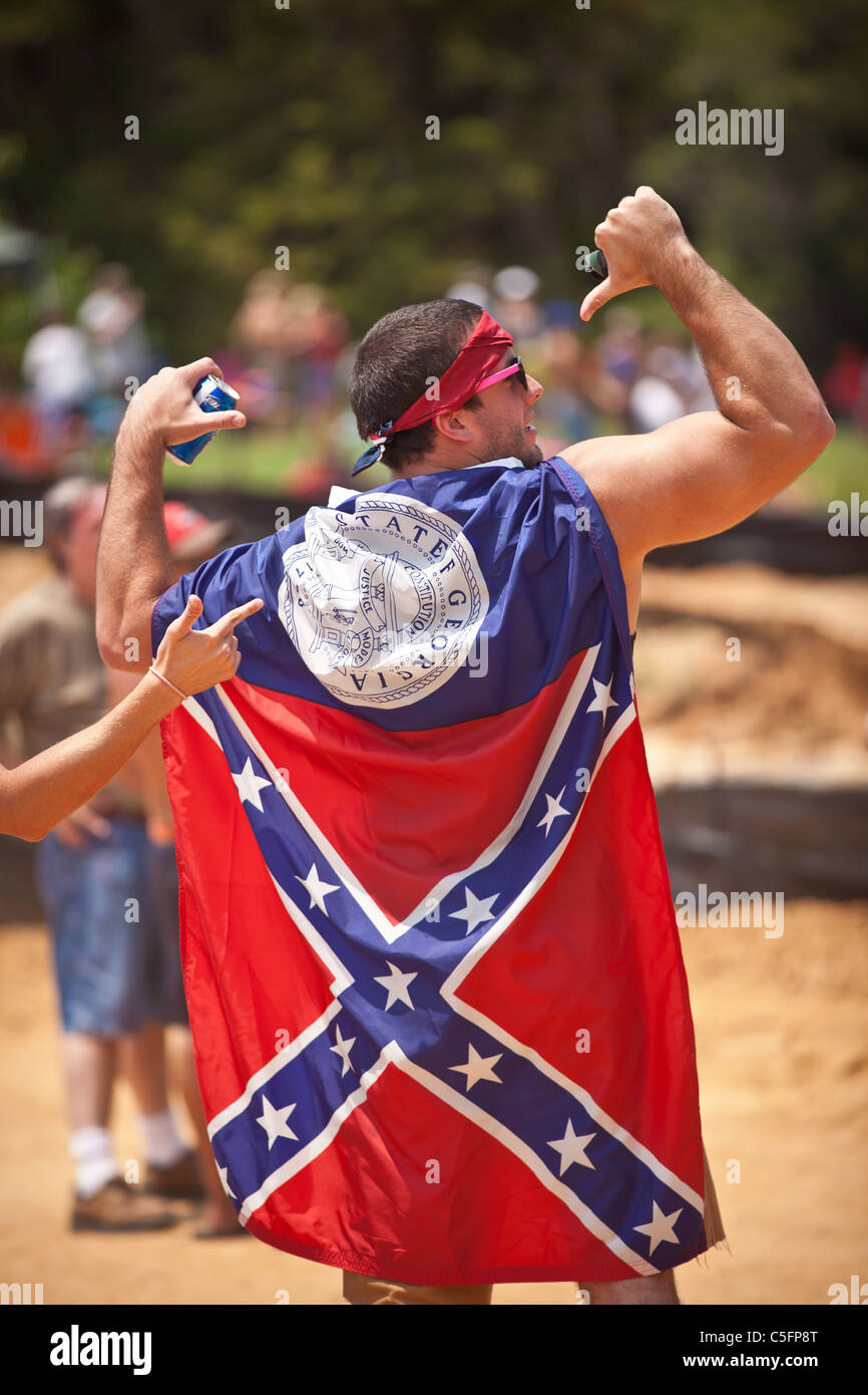 A participant wears a confederate flag during the annual Summer