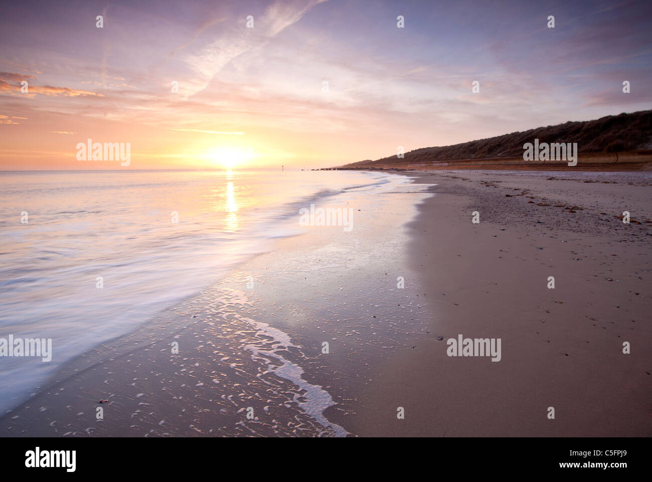 Waxham beach at sunrise on the Norfolk Coast Stock Photo