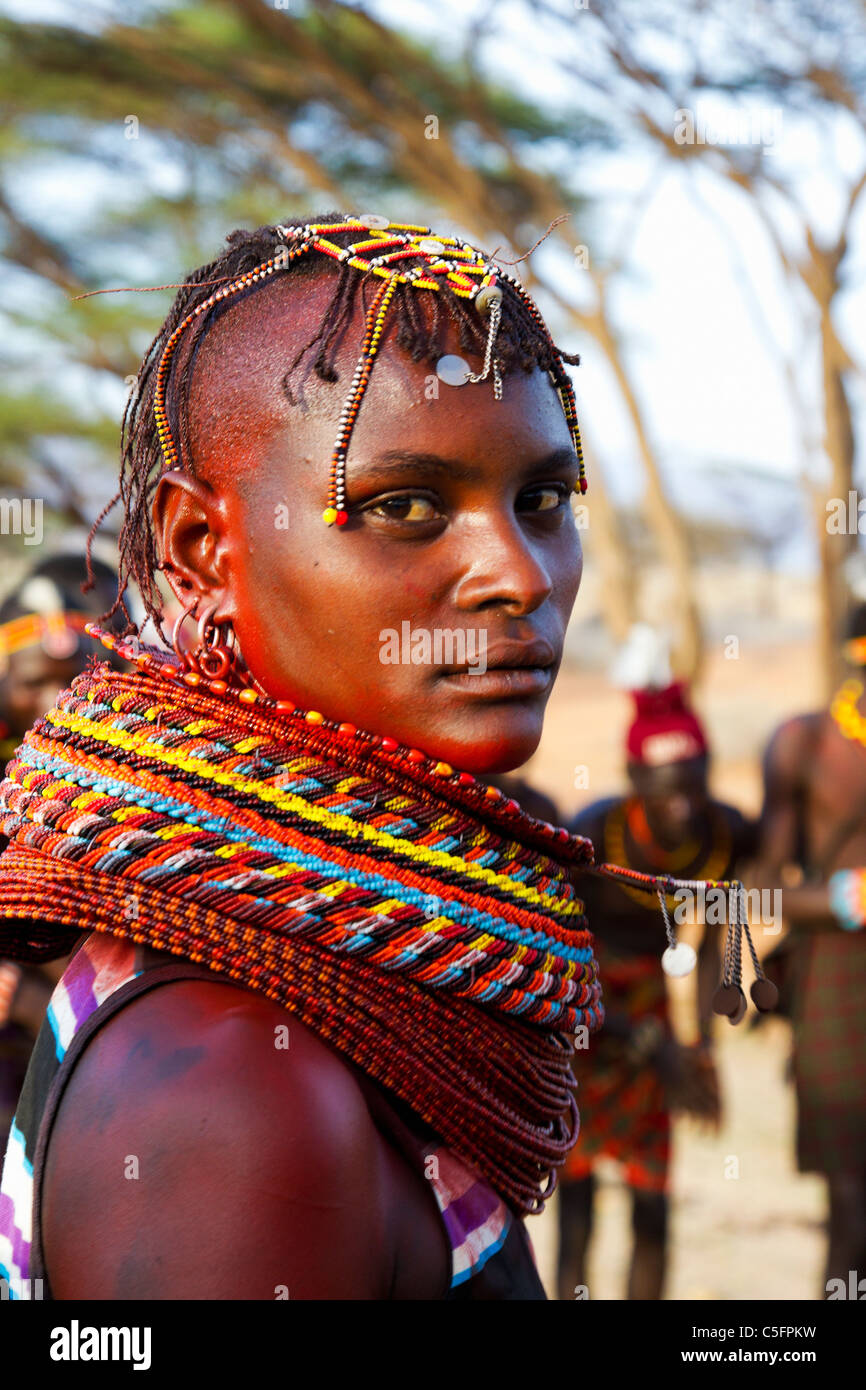 Turkana people live in Kenyas’ northwest district, a dry hot region. They are noted for raising camels and weaving baskets. Stock Photo
