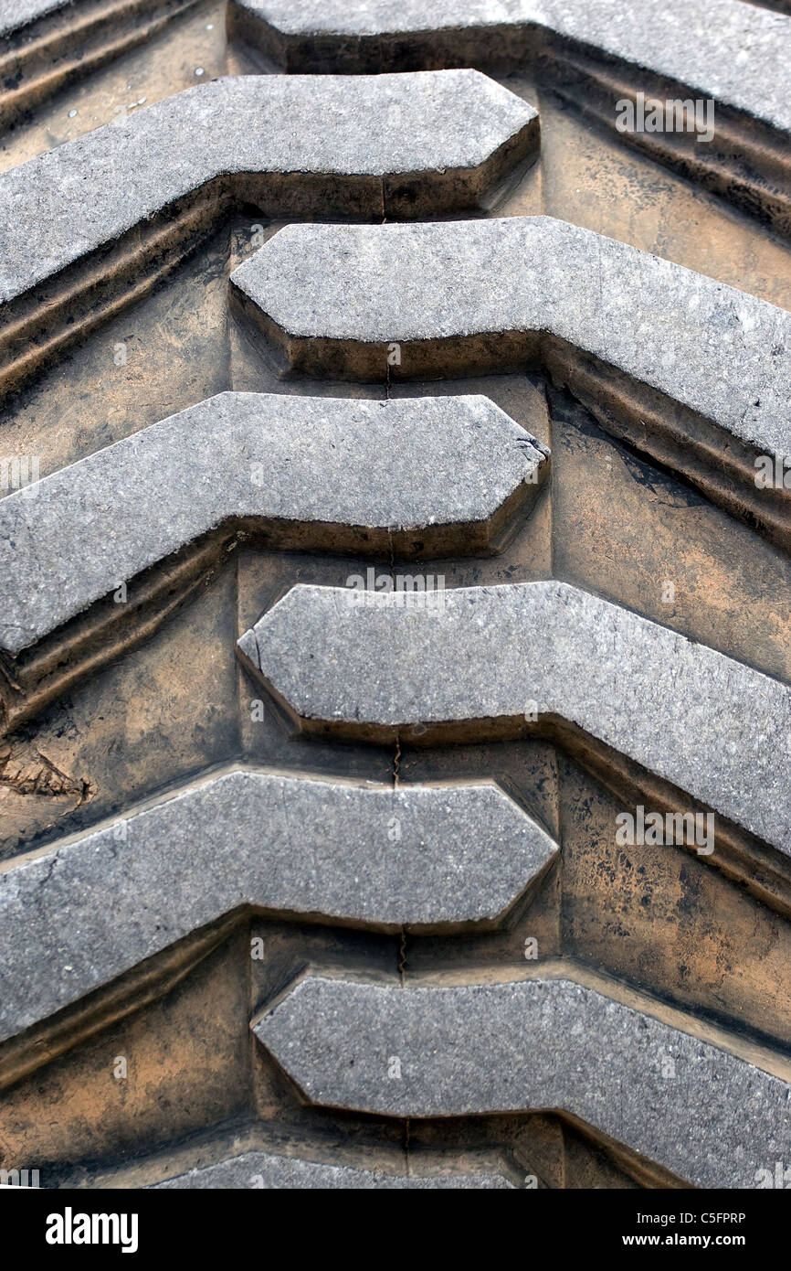 Detail up close of a tire tread from a tractor or other heavy duty construction machinery. Stock Photo