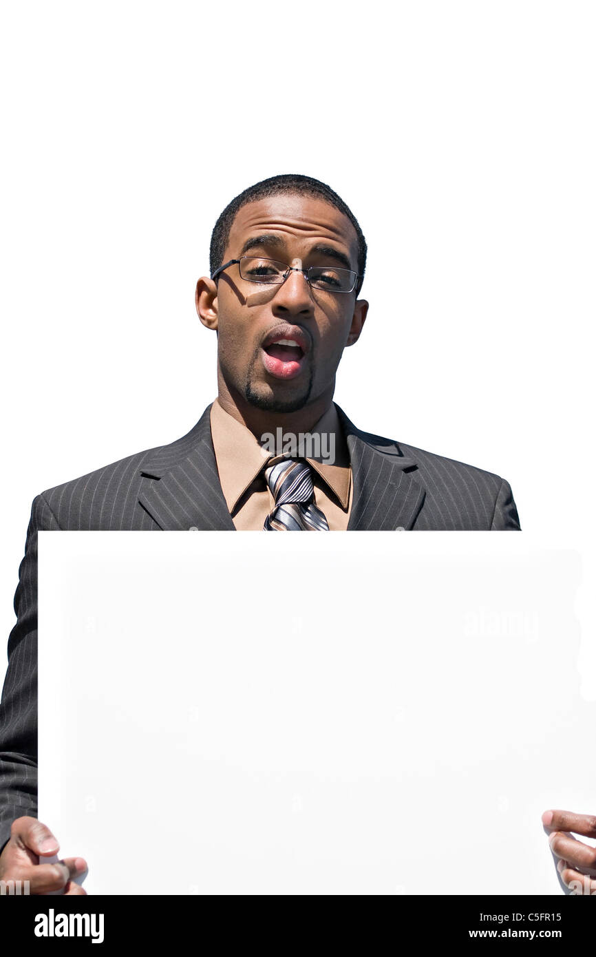 A Young Man Holds Up A Blank White Sign With Copyspace Stock Photo Alamy
