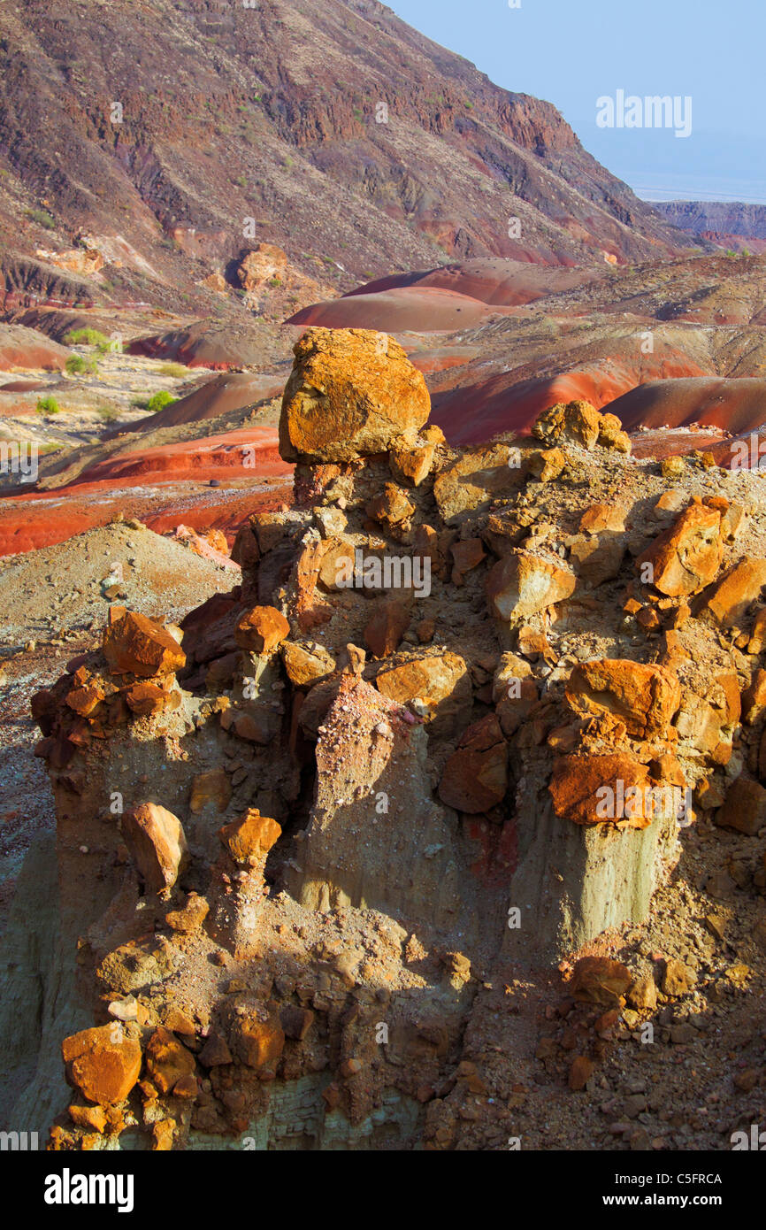 Hoodoo rock formations are tall thin shaped rocks that are topped by harder rocks Stock Photo