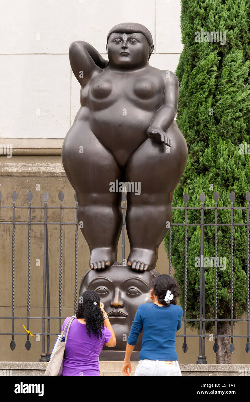 Plaza Botero, a symbol of Medellin, Colombia, here two women seem offended by a Botero sculpture Stock Photo