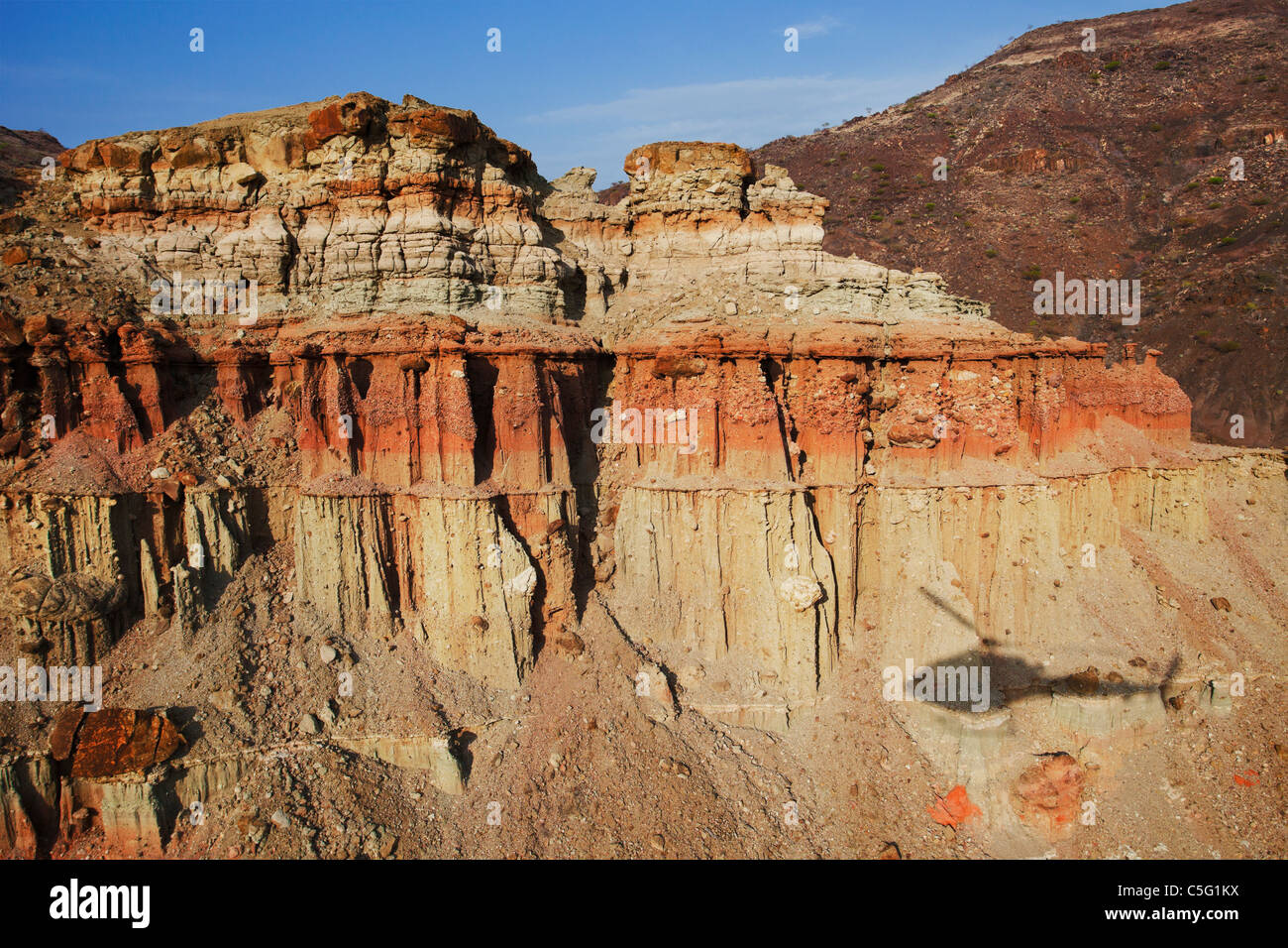 Helicopter shadpw flying through Painted valley within Suguta Valley Kenya. Stock Photo