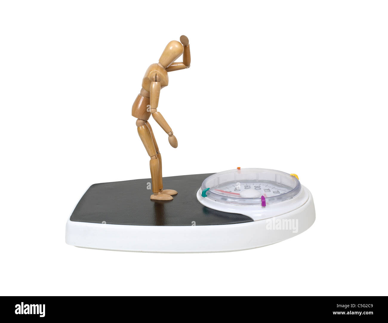 Model standing and looking down on a bathroom scale used to help maintain health - path included Stock Photo