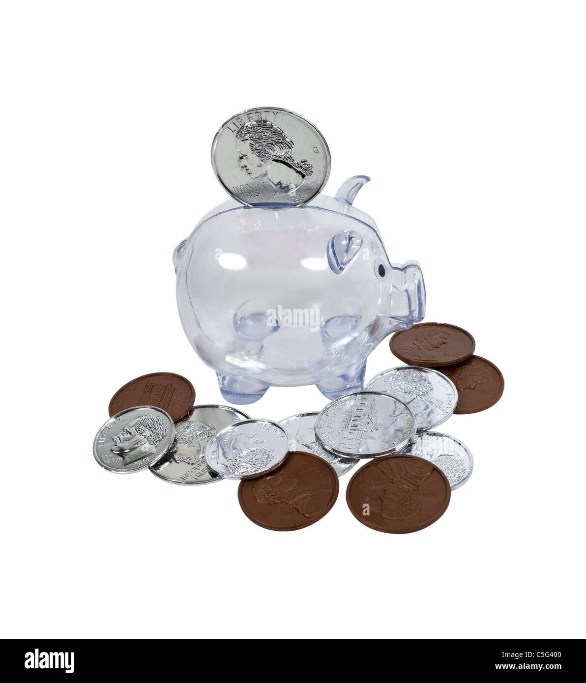 Big savings shown by a clear piggy bank with large coins scattered