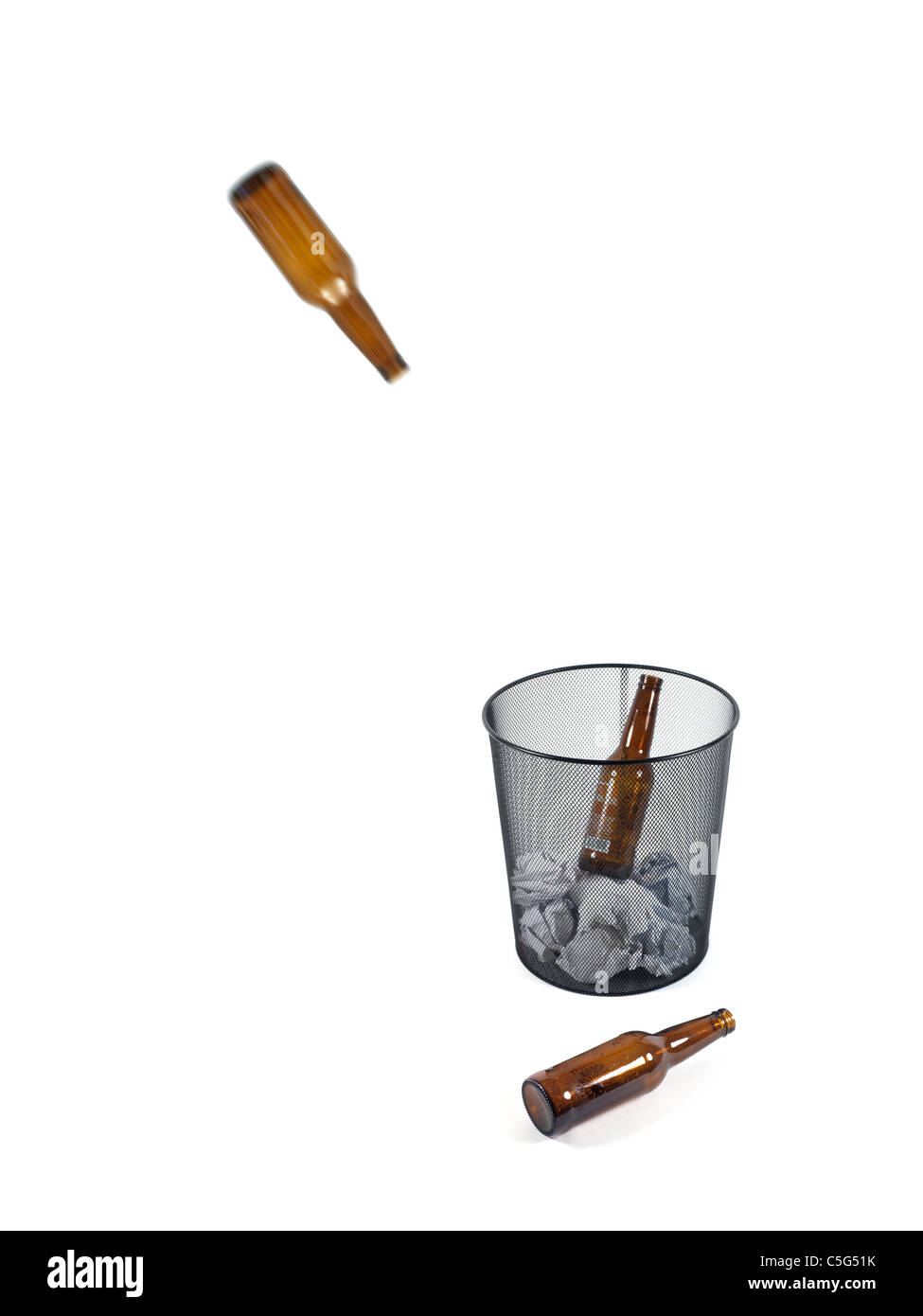 Bottles of beer in a trash can isolated against a white background