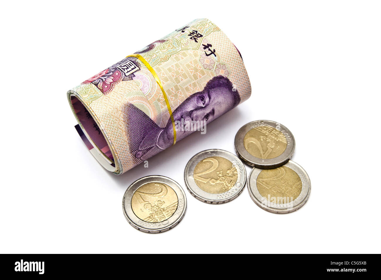 Roll of chinese money and euro coins closeup on white background Stock Photo