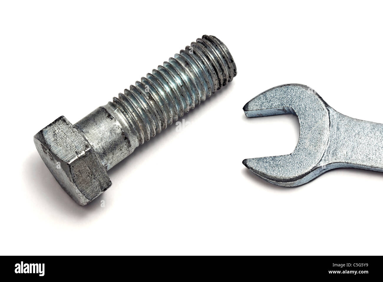 Wrench and bolt isolated on white background Stock Photo - Alamy