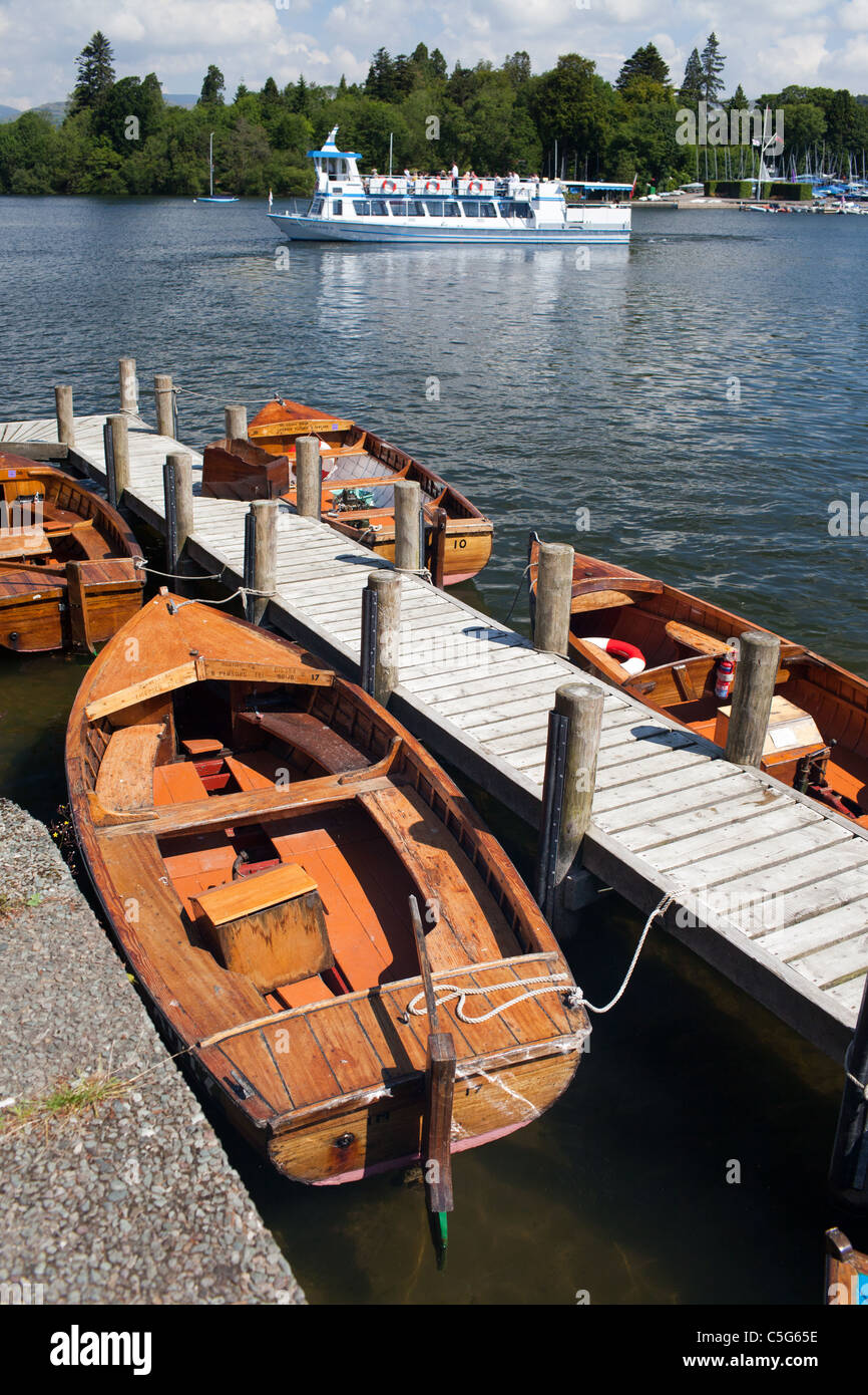 Hire boats tied up on a jetty at Bowness On Windermere on Lake