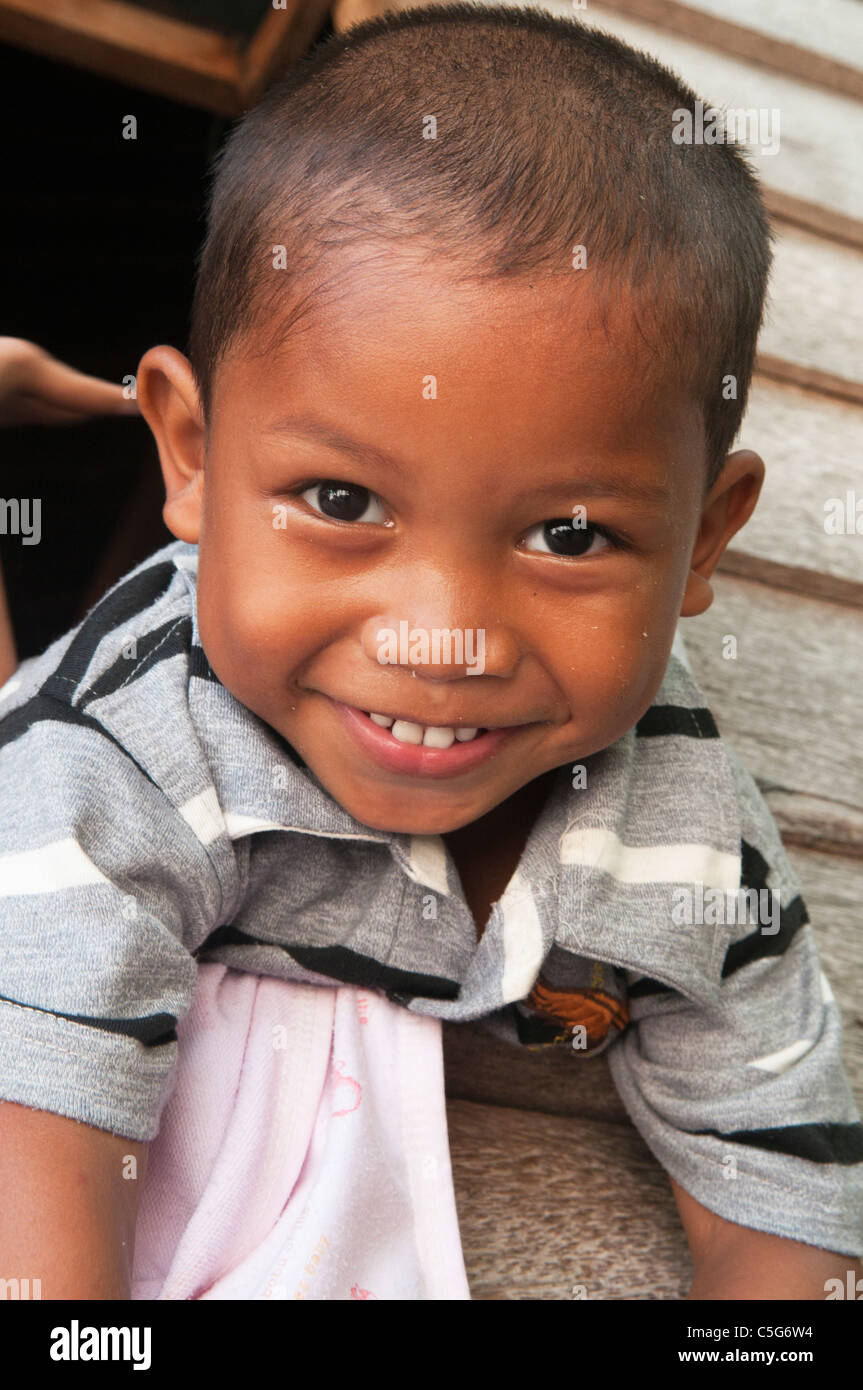 Sulu refugee boy with a big smile on Mabul Island, Borneo, Malaysia ...